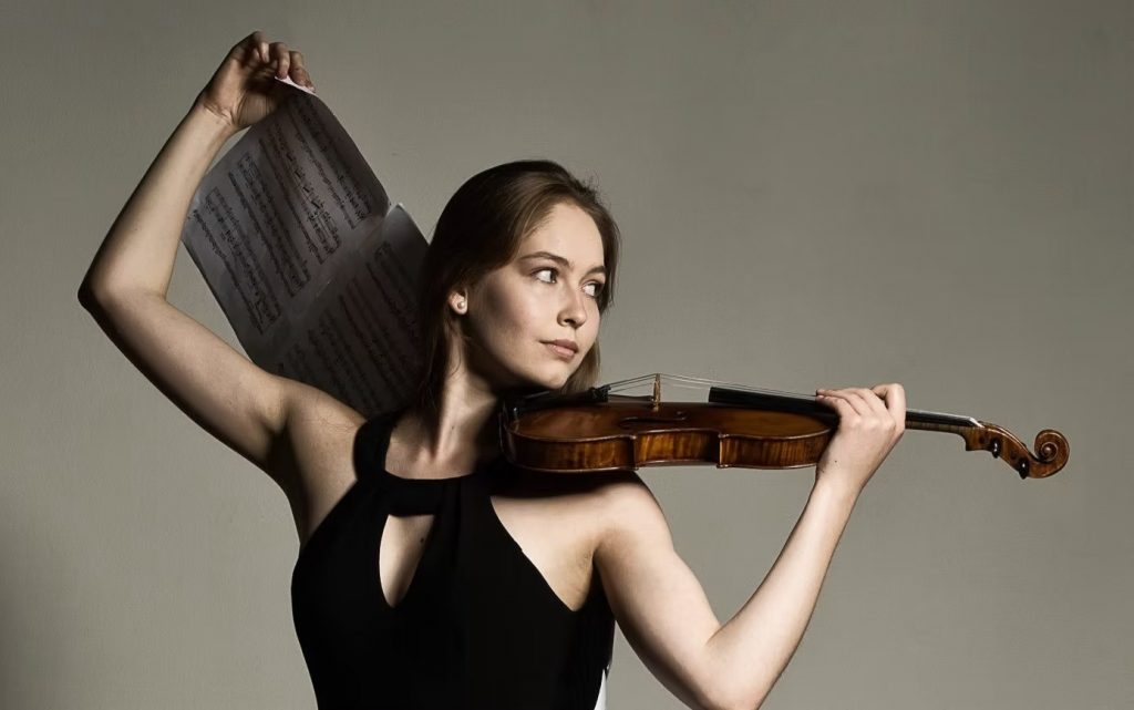 Woman with violin and sheet music